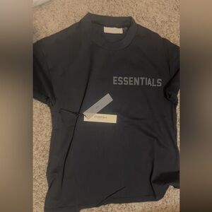 Small essential shirt fit like a medium.
